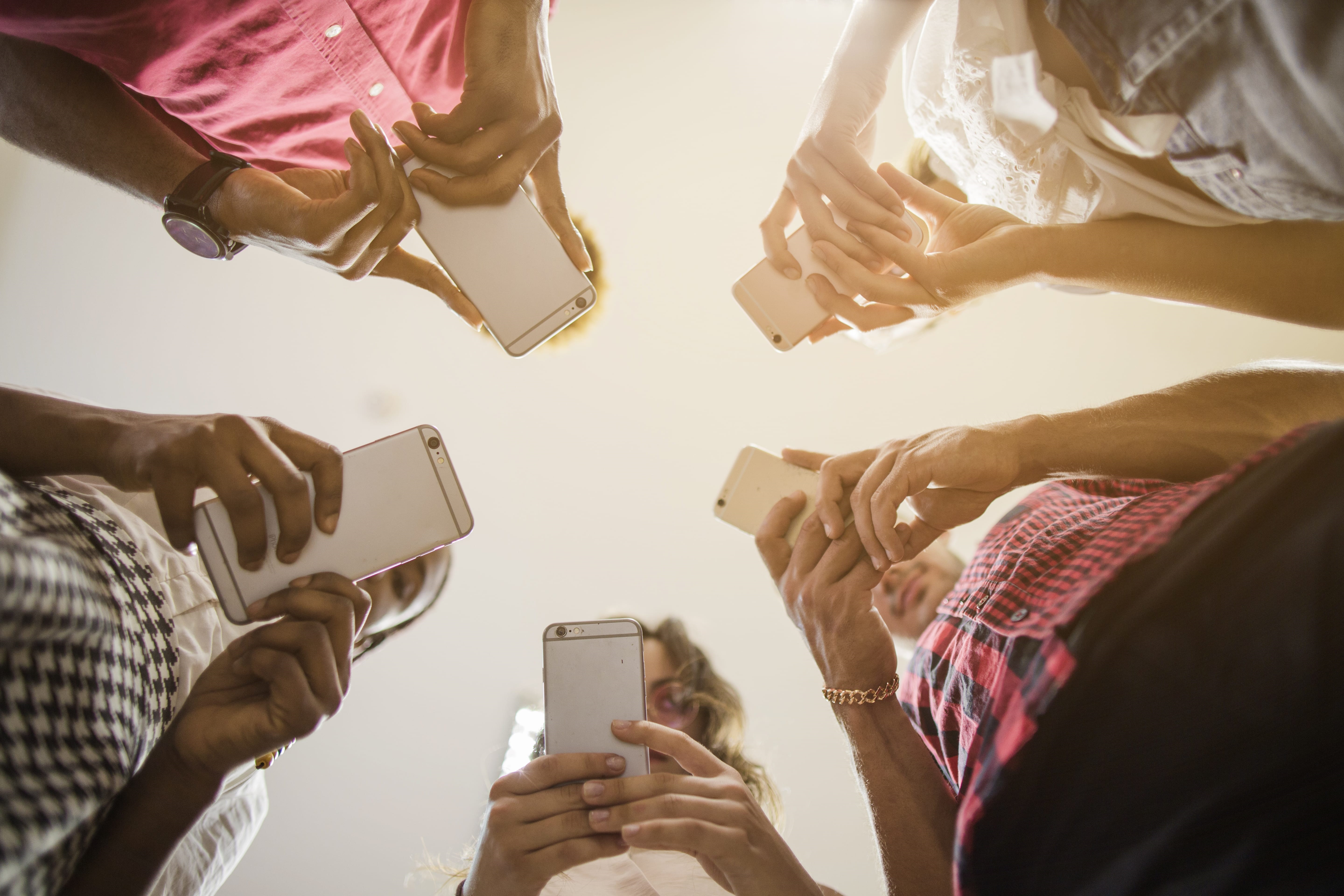 anonymous-people-busy-with-smartphones